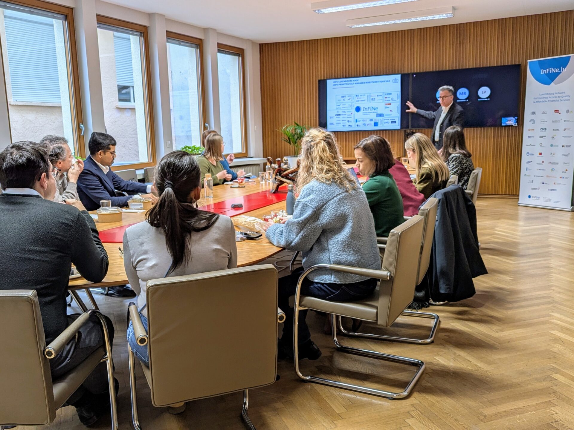 Professionals of the inclusive finance ecosystem in Luxembourg listening to a conference